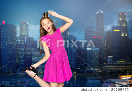 happy young woman in crown over night city 20109775
