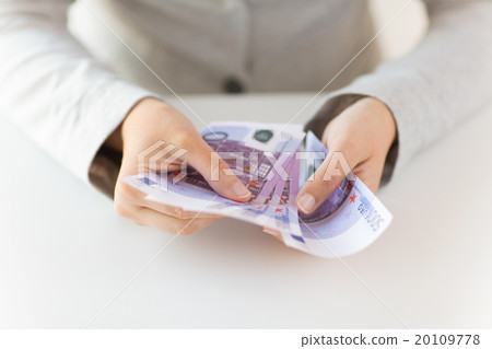 close up of woman hands counting euro money 20109778
