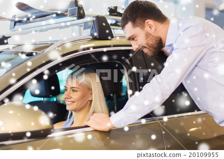 happy couple buying car in auto show or salon 20109955