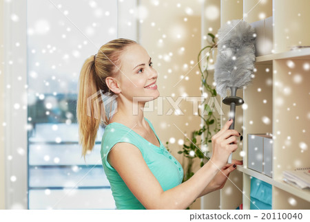 happy woman with duster cleaning at home happy woman with duster cleaning at home 20110040