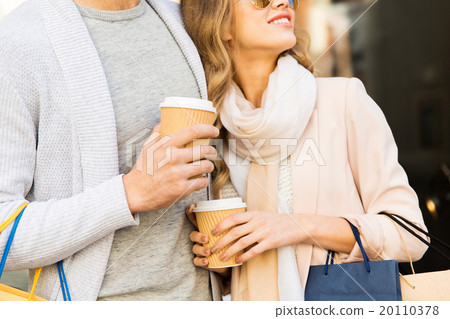 close up of couple with shopping bags and coffee 20110378