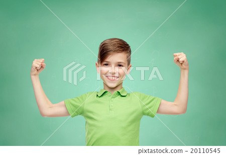 happy boy in polo t-shirt showing strong fists happy boy in polo t-shirt showing strong fists 20110545