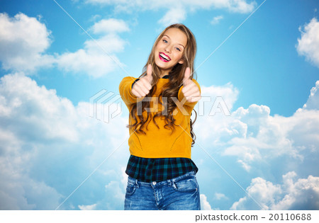 happy young woman or teen girl showing thumbs up 20110688