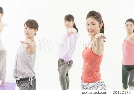 A woman receiving a yoga lesson A woman receiving a yoga lesson 20112173