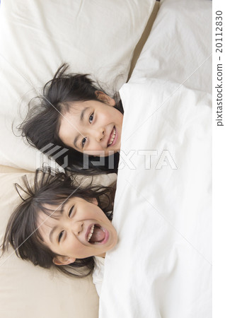 Young sister going into bed 20112830