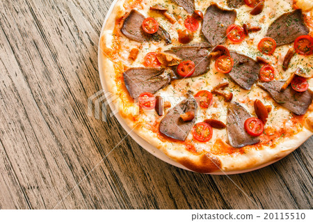 pizza on wooden background pizza on wooden background 20115510