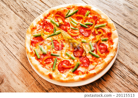 pizza on wooden background pizza on wooden background 20115513