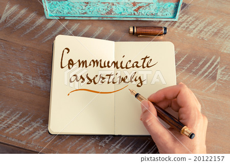 Handwritten text COMMUNICATE ASSERTIVELY Handwritten text COMMUNICATE ASSERTIVELY 20122157