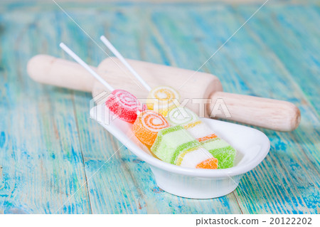 Colorful sweet jellies with sugar in a white-ware Colorful sweet jellies with sugar in a white-ware 20122202