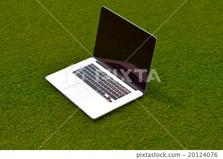laptop computer on grass 20124076