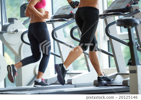 woman exercising on treadmill in gym 20125146