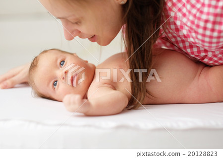 One month old newborn baby with mother 20128823