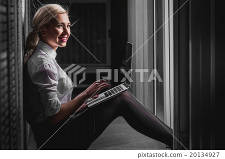 Young engineer businesswoman in server room 20134927