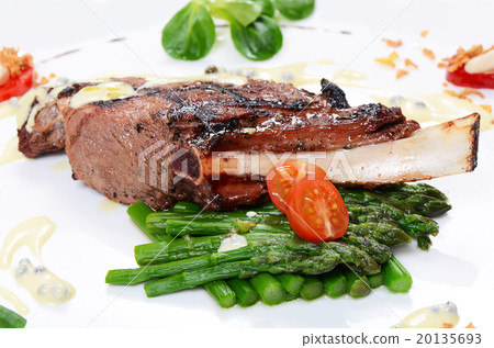 rack of lamb on grill with an asparagus 20135693