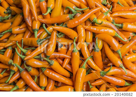 Orange chili peppers, closeup view Orange chili peppers, closeup view 20140082