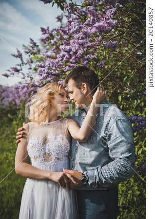 Portraits of a young pair in lilac bushes 3158. Portraits of a young pair in lilac bushes 3158. 20140857