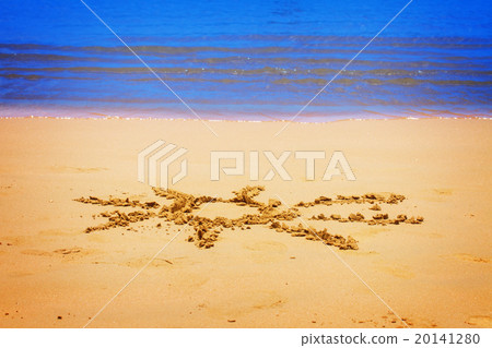 sun drawn on sandy beach 20141280