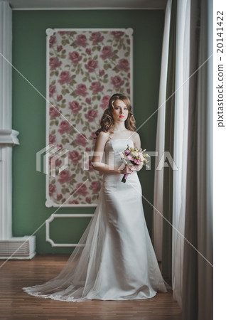 The girl with a bouquet at a window 2675. 20141422