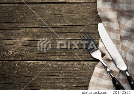 fork and knife on old wooden table 20142535