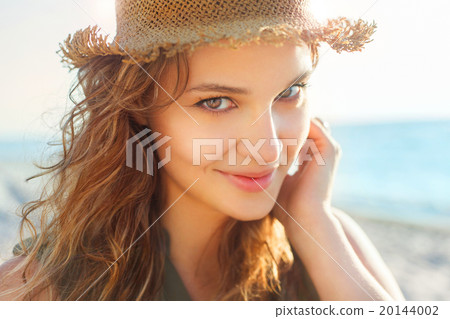 Beautiful girl on a beach 20144002