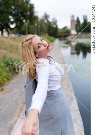 Follow me, Beautiful sexy business woman holds the 20144242