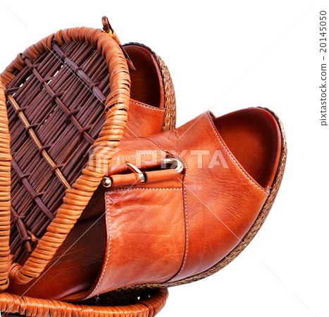 Woman shoes in basket isolated on white 20145050