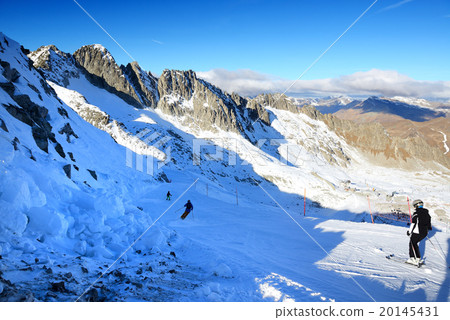 Ski slope and skiers at Presena glacier ski area 20145431