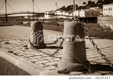 Stub posts linked in a chain on a quay Stub posts linked in a chain on a quay 20145457