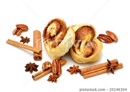 Isolated baked buns with cinnamon sticks Isolated baked buns with cinnamon sticks 20146304
