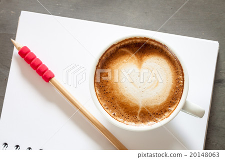Coffee cup with notepad on grey background Coffee cup with notepad on grey background 20148063