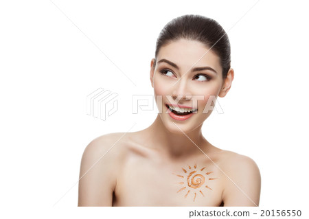 Girl with cream sun shape drawing on chest 20156550