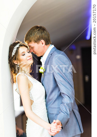 Wedding couple holding hands and embracing. Wedding couple holding hands and embracing. 20157170