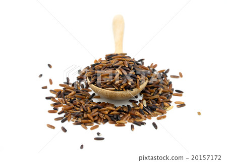 Black rice in a wooden spoon on white background. Black rice in a wooden spoon on white background. 20157172