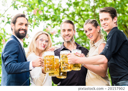 Friends or colleagues on beer garden after work Friends or colleagues on beer garden after work 20157902