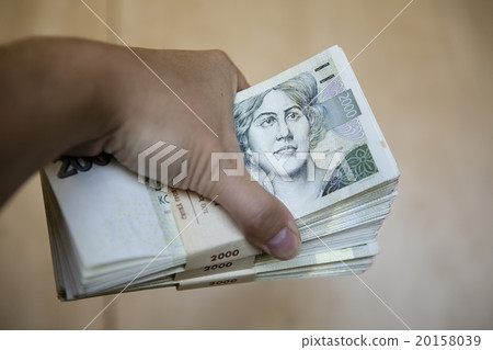 pack of money - big pile of banknotes in hand pack of money - big pile of banknotes in hand 20158039