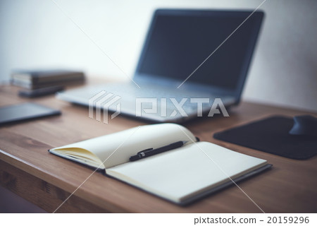 Stylish freelancer workspace with laptop open 20159296