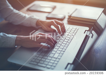 Working at home with laptop woman writing a blog 20159306