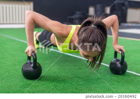 Fit woman young doing push ups exercise with 20160492