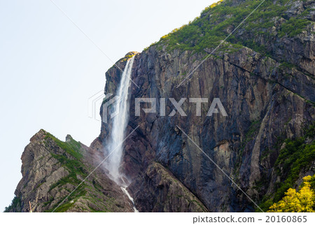 High waterfall flowing from steep cliffs on rocks 20160865