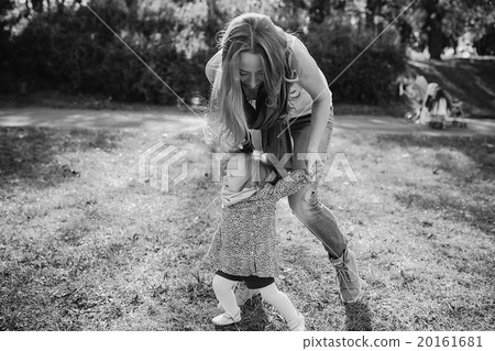 young family walking in the park 20161681
