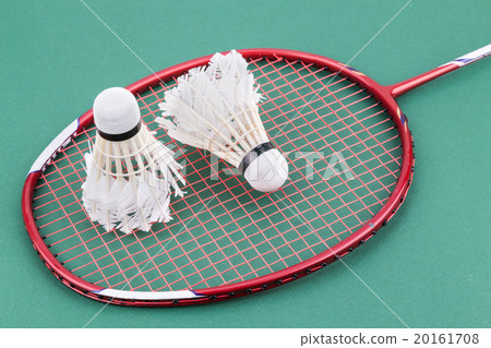 Two worned out badminton shuttlecock with racket Two worned out badminton shuttlecock with racket 20161708