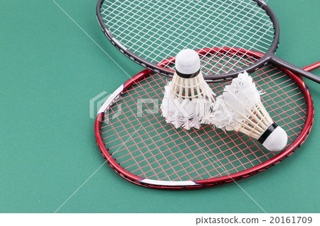 Two worned out badminton shuttlecock with racket Two worned out badminton shuttlecock with racket 20161709