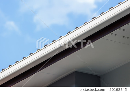White gutter on the roof top of house White gutter on the roof top of house 20162845