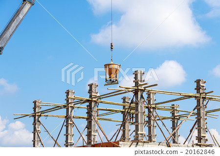 Worker working in construction on blue sky Worker working in construction on blue sky 20162846