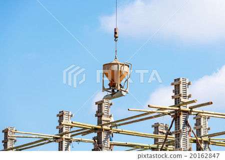 Worker working in construction on blue sky Worker working in construction on blue sky 20162847