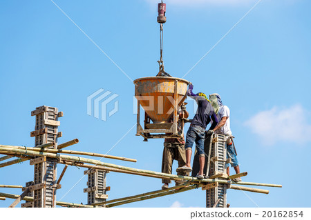Worker working in construction on blue sky Worker working in construction on blue sky 20162854