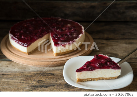 Wedge of cheesecake on the wooden table Wedge of cheesecake on the wooden table 20167062