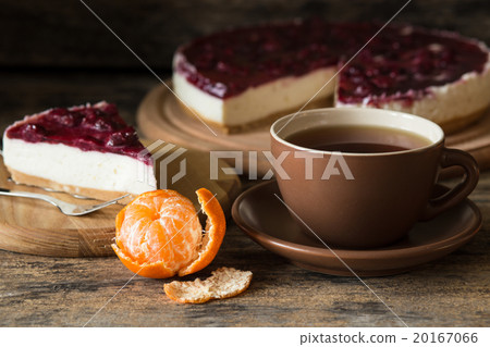 Cup of black tea with slice of cheesecake Cup of black tea with slice of cheesecake 20167066