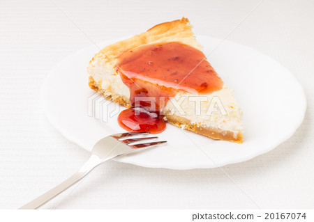 Piece of cheesecake on white saucer Piece of cheesecake on white saucer 20167074