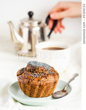 vegan muffin with carob, raisins and poppy seeds vegan muffin with carob, raisins and poppy seeds 20168152